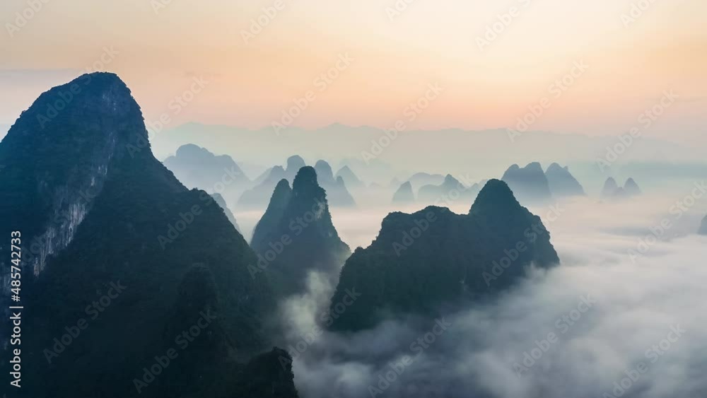 Aerial footage of beautiful mountain and clouds with fog natural