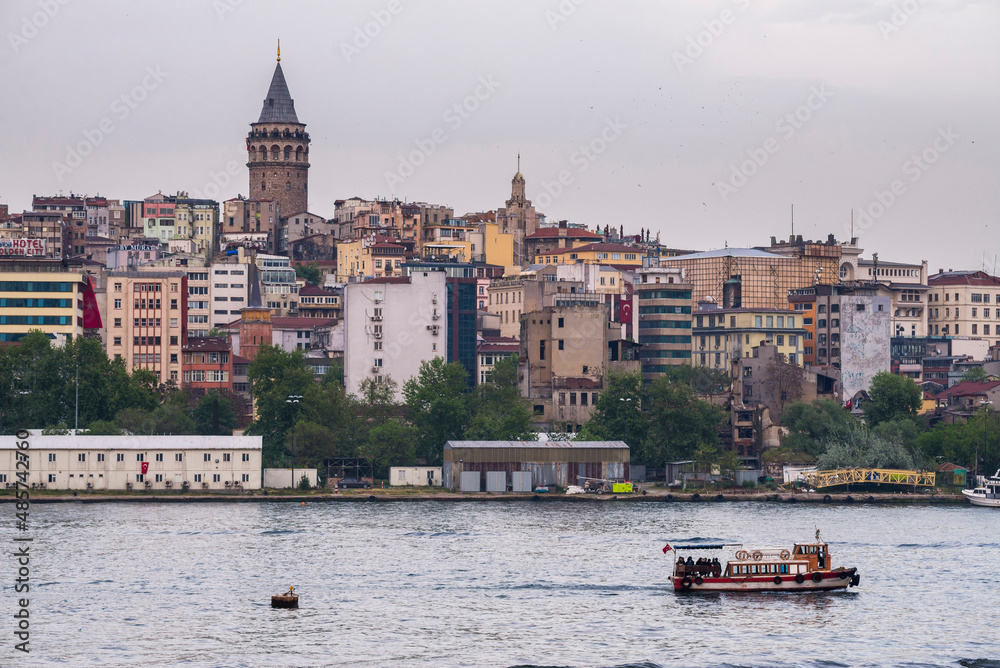Fototapeta premium Galata Tower (Galata Kulesi) seen across the Golden Horn (primary inlet of Bosphorus), Istanbul, Turkey, Eastern Europe