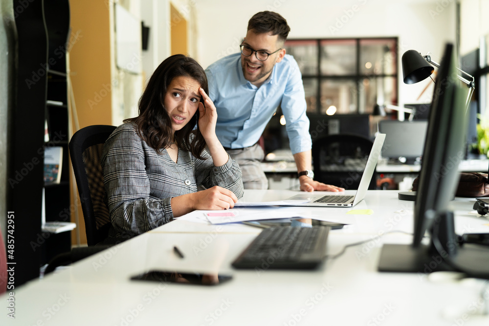 Colleagues arguing in office. Angry businessman yelling at his collegue. Colleagues arguing in office. Angry businessman yelling at his collegue.