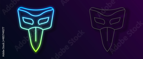 Glowing neon line Carnival mask icon isolated on black background. Masquerade party mask. Vector