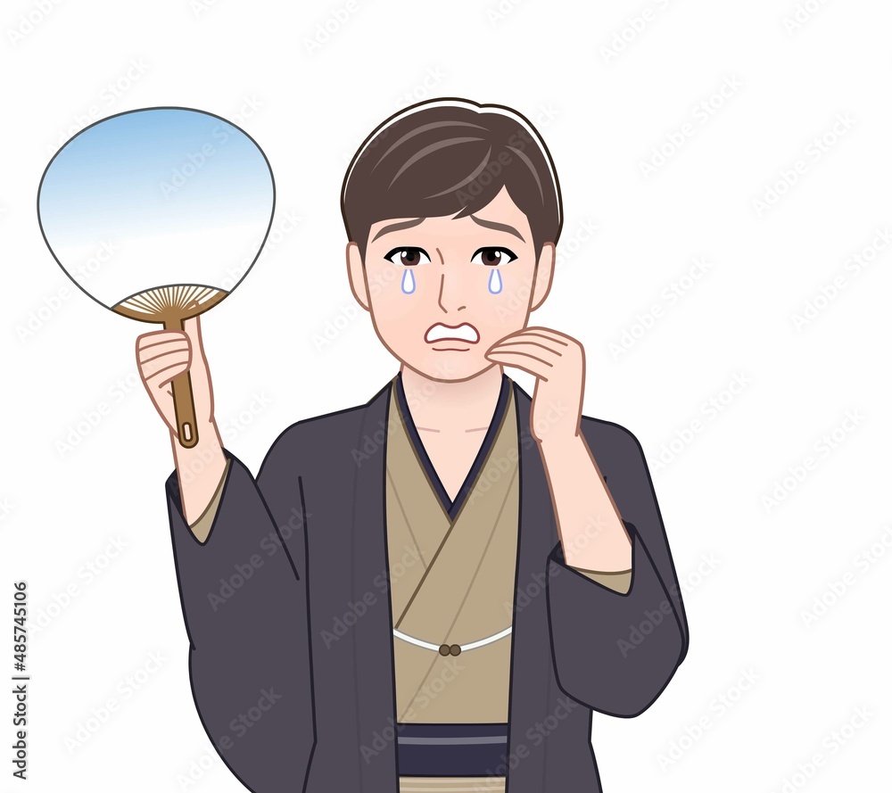 羽織袴を着てうちわを持つ男性