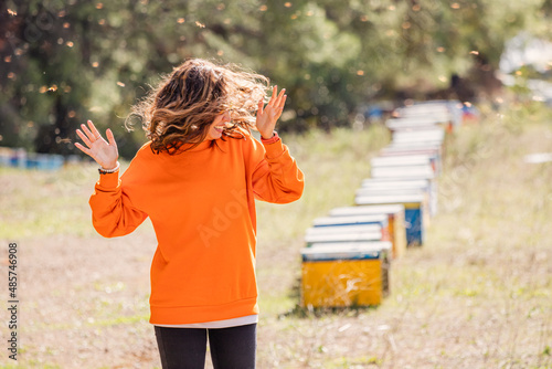 Принти на полотні Screaming woman was attacked by an aggressive and dangerous swarm of killer bees in a honey apiary
