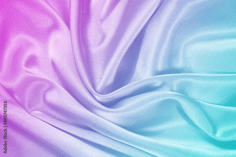 Obraz premium Pink tuquoise silk satin. Gradient. Wavy folds. Shiny fabric surface. Beautiful purple teal background with space for design. 