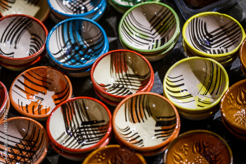 Bowls are white with multicolored colors and Turkish patterns, selective focus.
