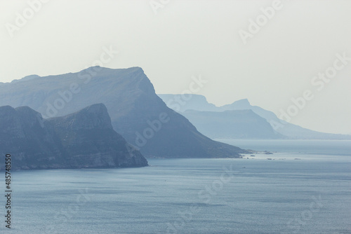 View on the Ocean with mountains in the background in a misty day at the Cape of Good Hope south of Cape Town in the Western Cape of South Africa