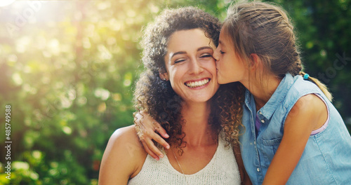 The purest love theyll ever know. Shot of an affectionate little girl spending quality time with her mother outdoors. photo