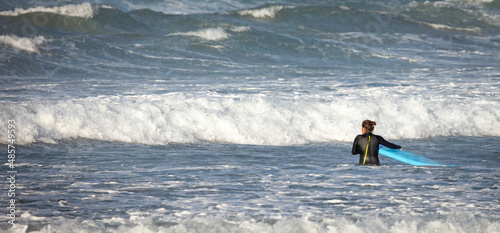 Surfer practicing her skills in the Atlantic ocean at Lanzarote
