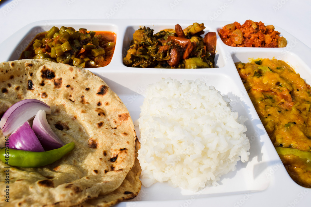 Indian Simple homemade lunch of Roti, sabji with mix veg brinjal potato ...