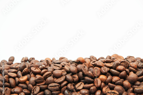 coffee on a white background close-up. concept of making coffee. roasted coffee beans