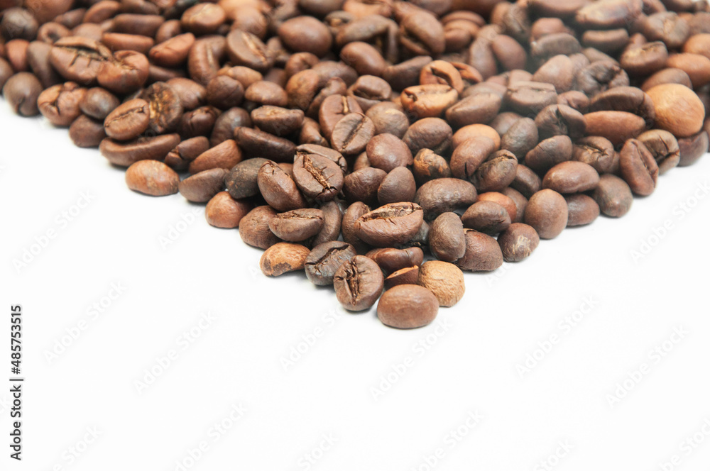  coffee on a white background close-up. concept of making coffee. roasted coffee beans