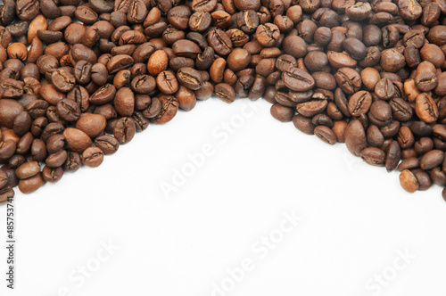 coffee on a white background close-up. concept of making coffee. roasted coffee beans