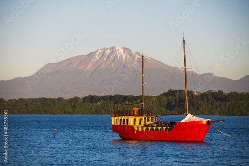 Capitan Haase Traditional Sailing Ship on Llanquihue Lake with Calbuco Volcano behind, Puerto Varas, Chile Lake District, South America photo