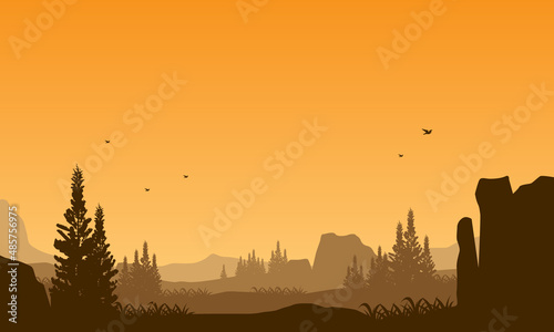 the beautiful atmosphere of a sunset in the countryside with great mountain views