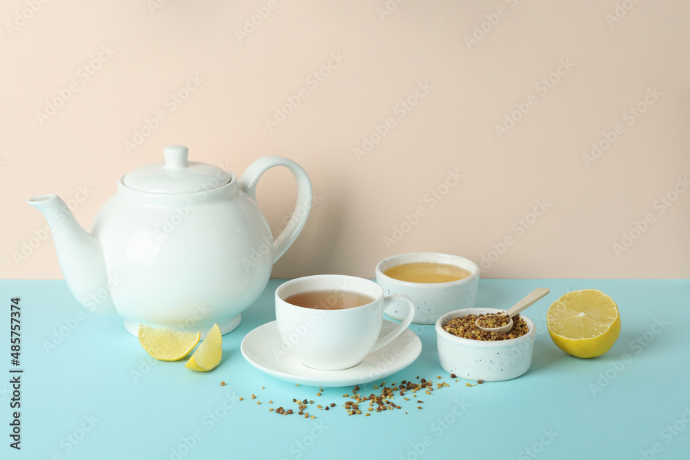 Fototapeta premium Concept of hot drink with buckwheat tea on blue table