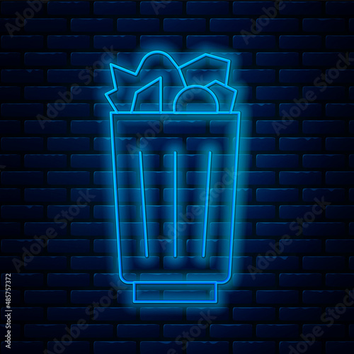 Glowing neon line Full trash can icon isolated on brick wall background. Garbage bin sign. Recycle basket icon. Office trash icon. Vector