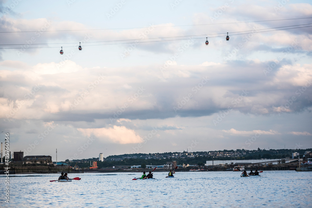 Kayaking under the Emirates Air Line Cable Car across the River Thames, Greenwich, London, England