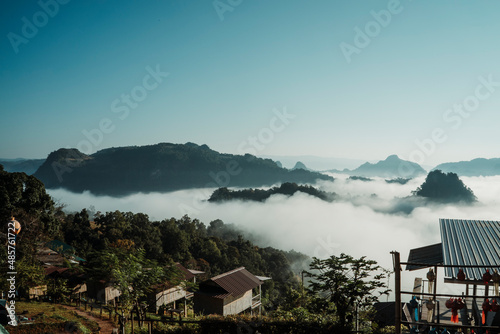 Fotografie A village in the middle of a mountain surrounded by a sea of mist