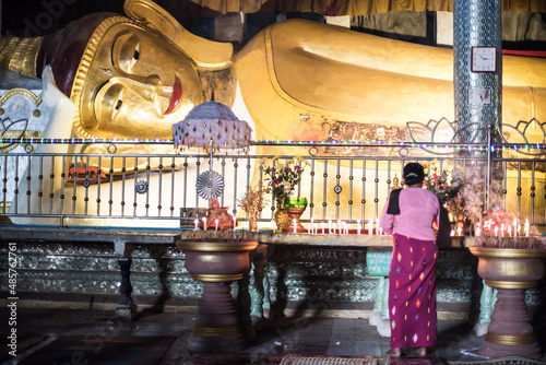 Buddhist woman praying inside Sadan Cave (aka Saddar Caves), Hpa An, Kayin State (Karen State), Myanmar (Burma) photo