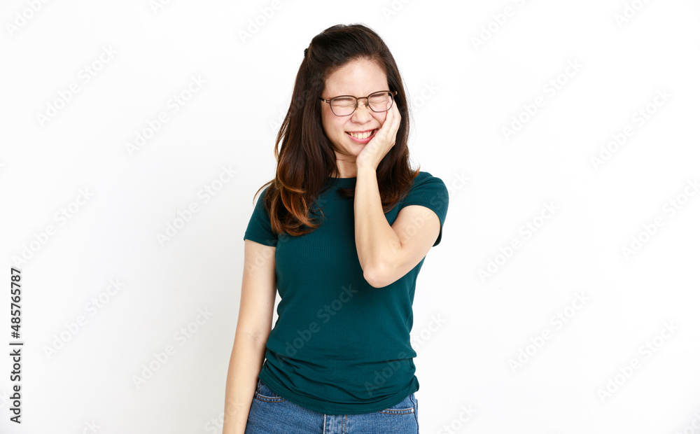 Studio isolated cutout closeup shot of Asian young shy female model in casual shirt and jeans shorts with optical eyeglasses standing holding hands cover cheek closed eyes smiling on white background Studio isolated cutout closeup shot of Asian young shy female model in casual shirt and jeans shorts with optical eyeglasses standing holding hands cover cheek closed eyes smiling on white background