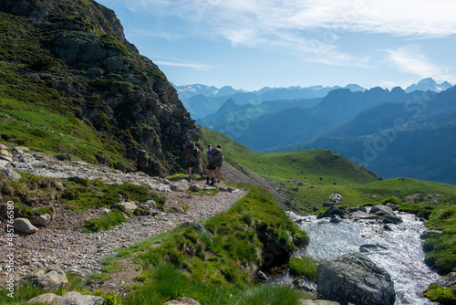 hikers in path of Pic du Midi Ossau in French Pyrenees mountains