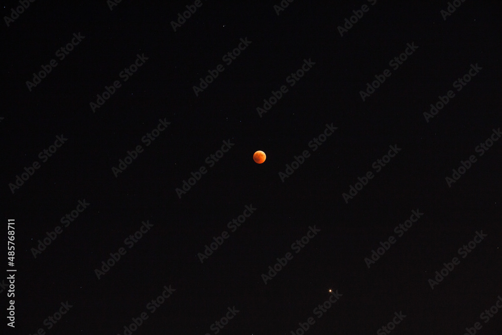 Full frame of a yellow Supermoon in a black sky Full frame of a yellow Supermoon in a black sky