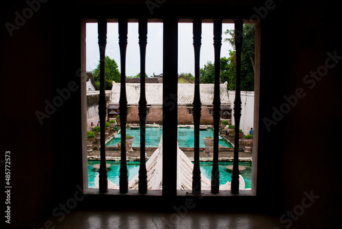 Swimming Baths Seen Through Ornate Windows at Taman Sari Water Castle, Yogyakarta, Java, Indonesia, Asia