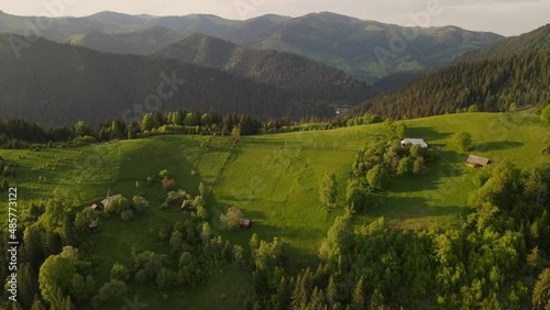 aerial view to a mountain village and farms in carpathians where people live in the mountains on farms