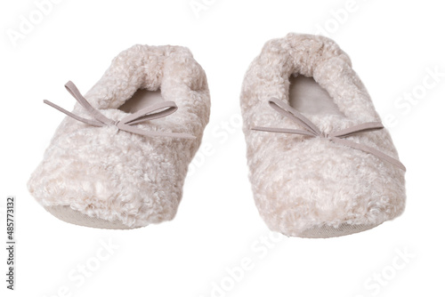 Slippers isolated. Close-up of a pair of female beige warm and soft cosy terry slippers isolated on white background. Womans shoes.