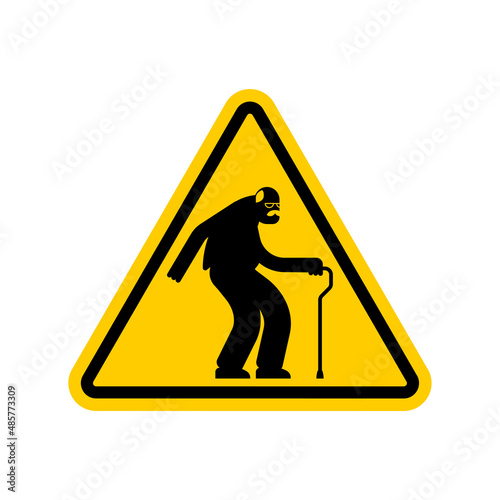Attention pensioner. Warning yellow road sign. Caution Old man