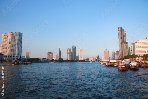 Tall buildings along the river in Thailand © Tosdy Prince Shutte