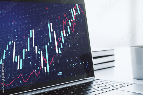 Modern computer monitor with abstract creative financial chart, research and strategy concept. 3D Rendering © Pixels Hunter