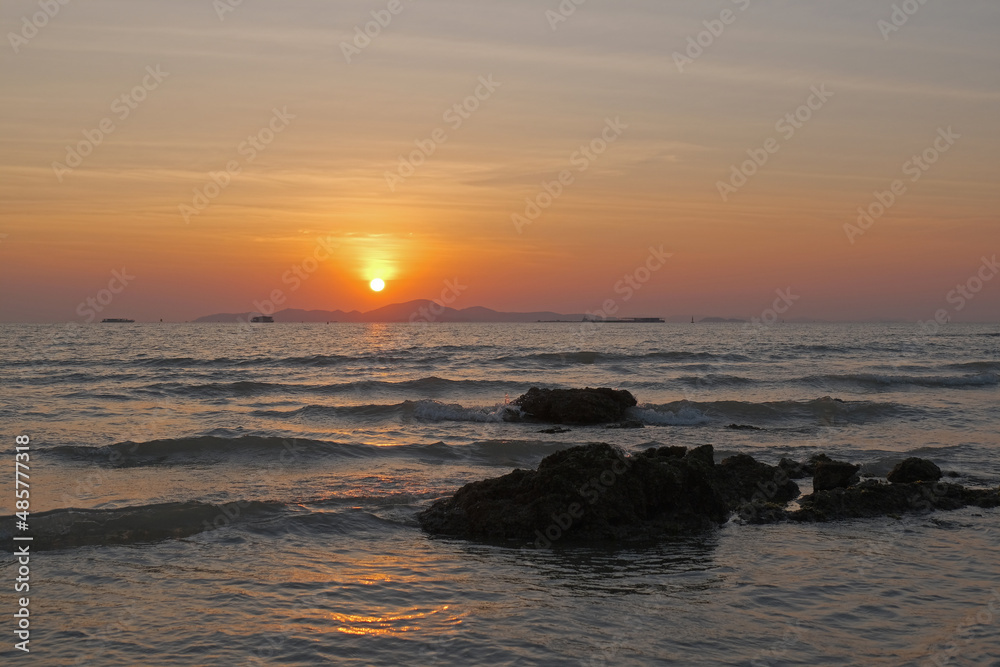 Beautiful tropical orange sunset at sea in Thailand Beautiful tropical orange sunset at sea in Thailand