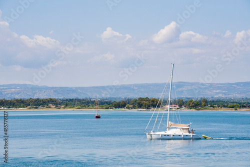 Syracuse (Siracusa), Sicily, sailing boat in Ortigia harbour on the Mediterranean Sea Coast, Italy, Europe