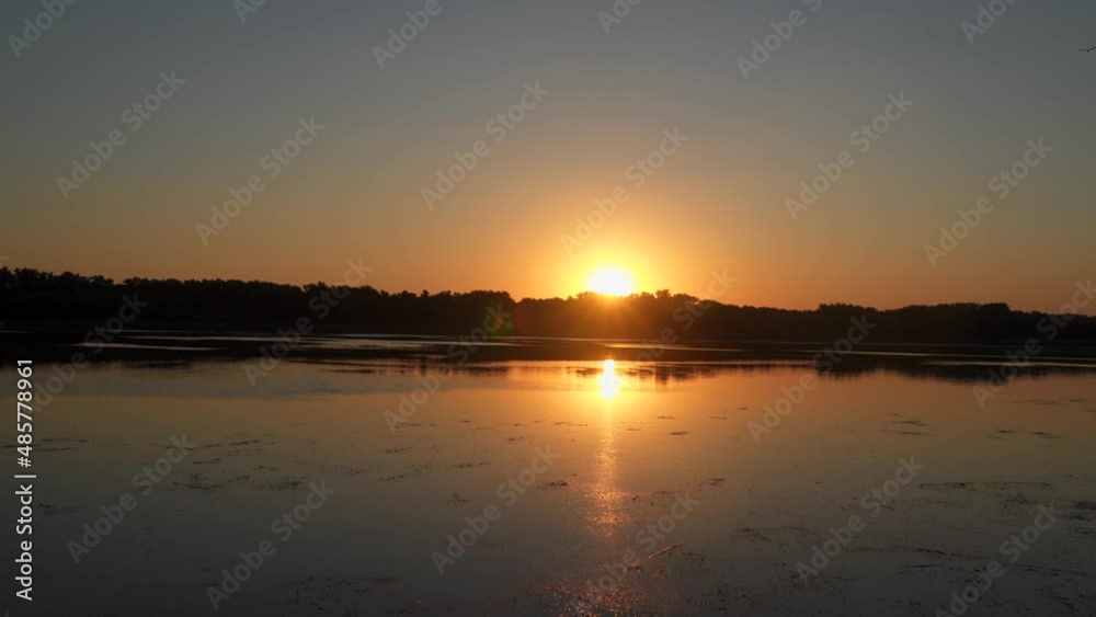 Picturesque sunset over the river. Natural background. Dnieper river in Ukraine Picturesque sunset over the river. Natural background. Dnieper river in Ukraine