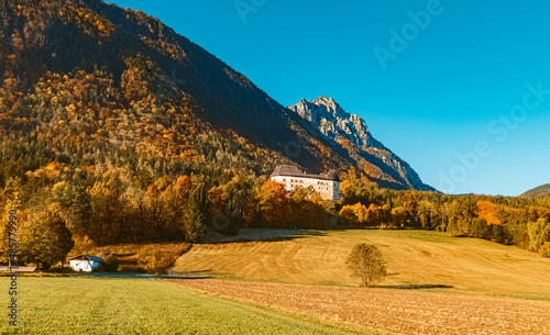 Beautiful alpine autumn or indian summer view with an old fortress near Piding, Bavaria, Germany photo