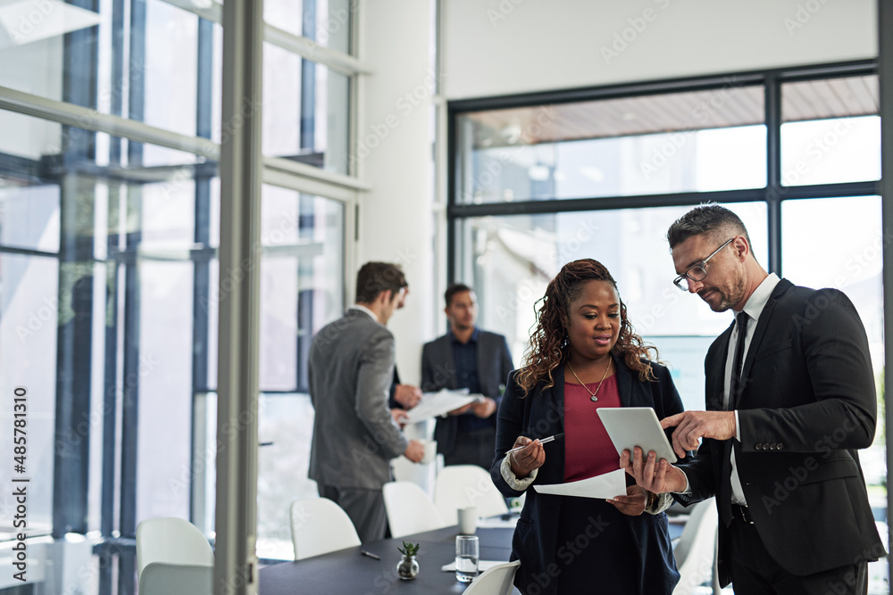 Ironing out the details. Shot of corporate businesspeople meeting in the boardroom. Ironing out the details. Shot of corporate businesspeople meeting in the boardroom.