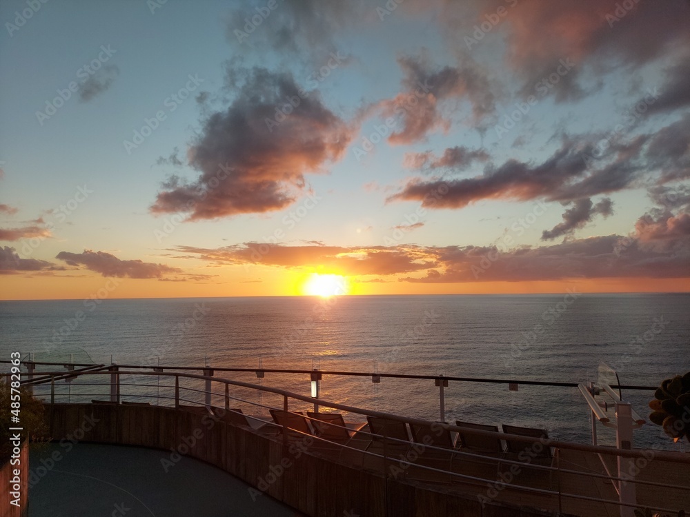 golden sunset and cloudy sky ,view from a cruise ship