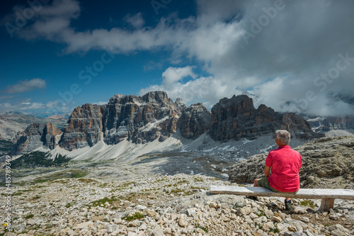 Trekker is watching Le Tofane mountain, Dolomites