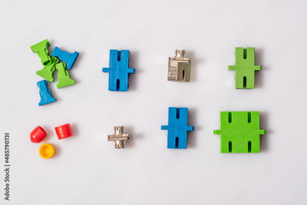 Obraz premium FC, SC adapters and plugs for them for single mode fiber, light background