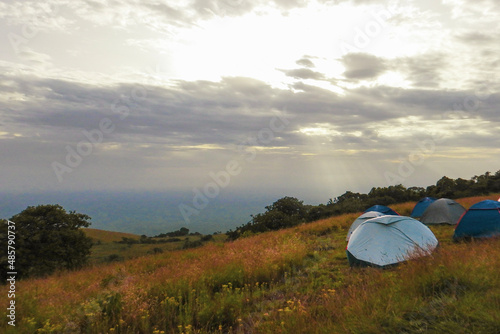Scenic view of camping tents in the wild against mountains at Chyulu National Park  Kenya