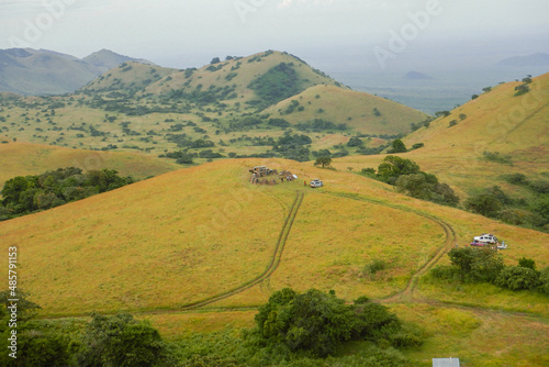 High angle view of a campsite in the panoramic mountain landscapes of Chyulu Hills, Chyulu National Park, Kenya photo