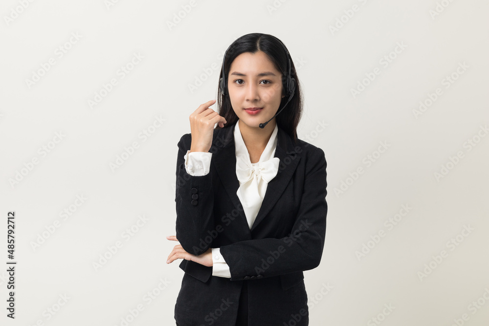 Happy young asian business woman call centre. Welcome female operator put on smalltalk headphone standing on isolated white background. Happy young asian business woman call centre. Welcome female operator put on smalltalk headphone standing on isolated white background.