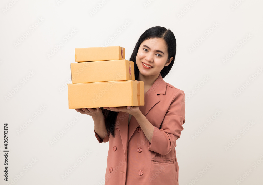 Young beautiful asian woman with many parcel cardboard standing on isolated white background. Delivery woman holding lot of parcel box sending to messenger. Young beautiful asian woman with many parcel cardboard standing on isolated white background. Delivery woman holding lot of parcel box sending to messenger.