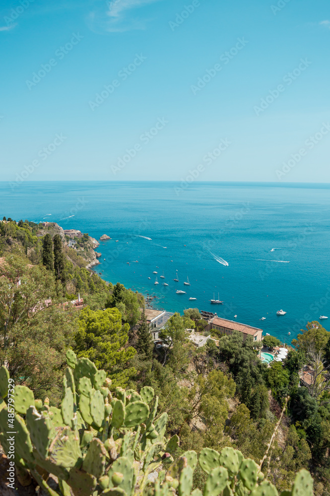 High view of turquoise Mediterranean sea in Taormina, Sicily, Italy during a summer day