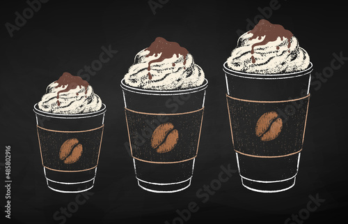 Coffee cups in three sizes with whipped cream