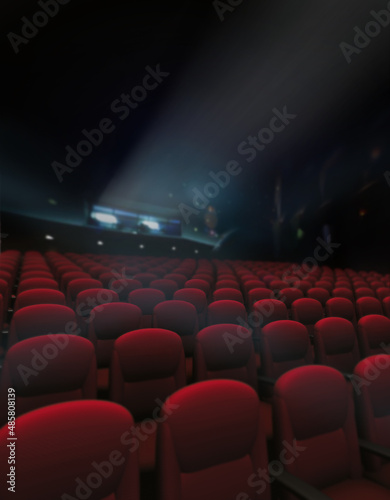 Empty red of seat and rows in cinema with projector lighting