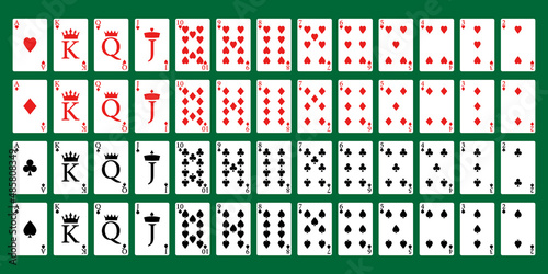 A full deck of poker playing cards on a green background. photo