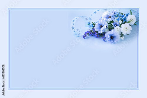 星模様のリボンと白いカーネーションと青いラナンキュラスとブルースターとワックスフラワーの花束のフレーム（造花） photo
