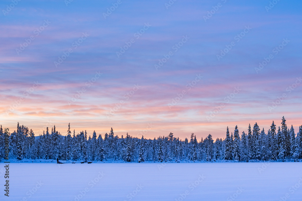 Fototapeta premium Torassieppi winter landscape on the frozen lake at sunset, Lapland, Finland