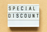 Lightbox with word special discount on wood background
